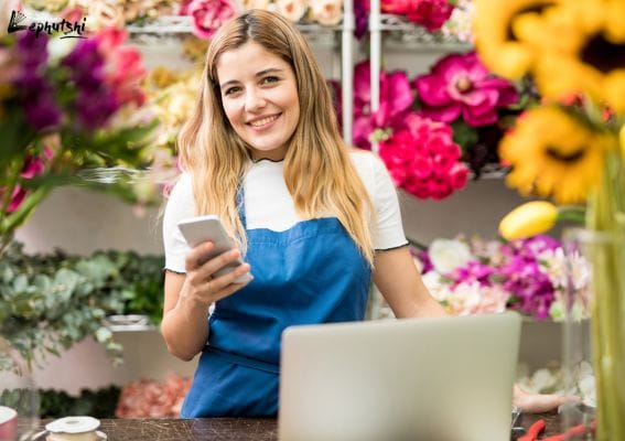 Botswana business owner using laptop and phone to attract online customers