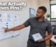 A Botswana business owner analyzing local search factors and map radius planning on an office board.